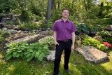 Chris in front of garden