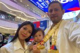 Daneil Fienco, wife, and baby, at Marianas Pro Mania