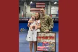 Sheyenne Schwenck, her husband and child.