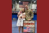 Sheyenne Schwenck, her husband and child.