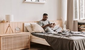 Person working on laptop in bed