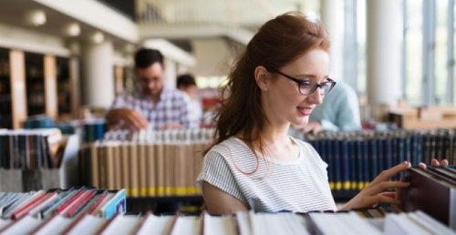 student woman library books