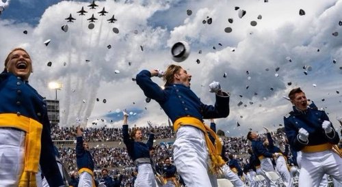 Norwich Welcomes USAFA Graduates - Images of grads throwing caps in the air and jet flyover