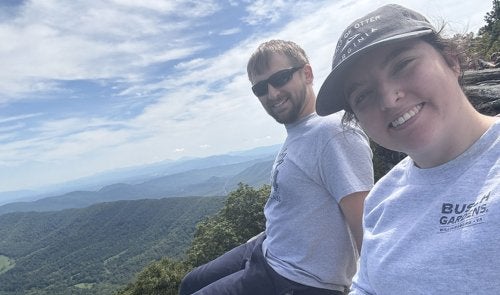 Ashleigh and husband on top of mountain