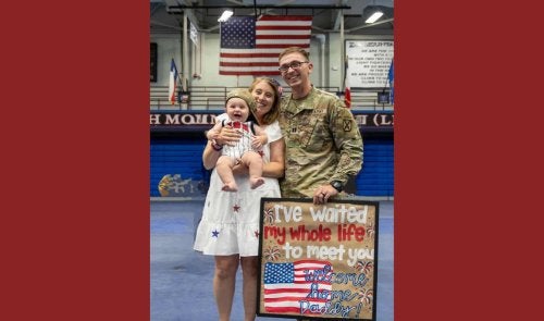 Sheyenne Schwenck, her husband and child.