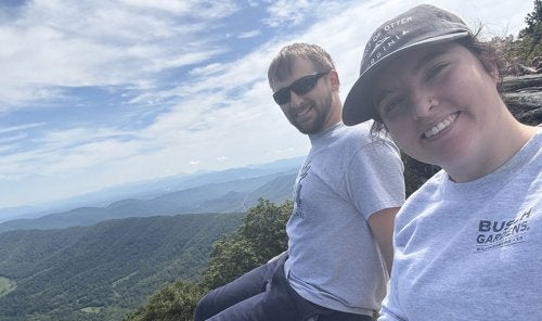 Ashleigh and husband on top of mountain