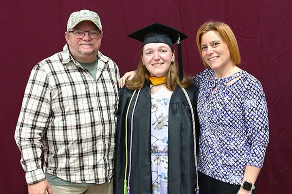 Ashley with family at graduation.