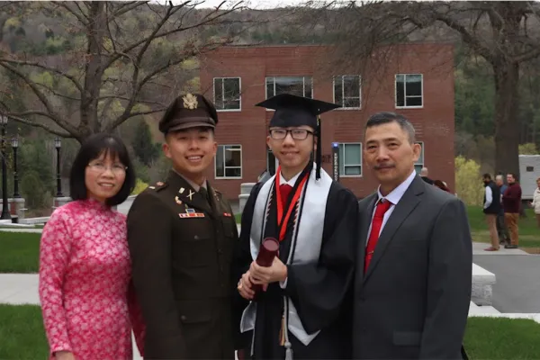 jimmy luong at graduation, on campus with parents and brother
