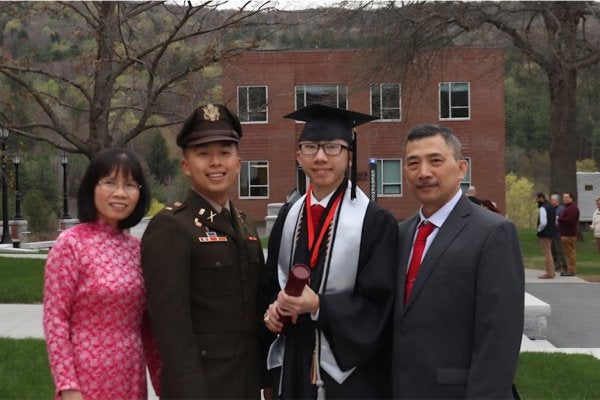 jimmy luong at graduation, on campus with parents and brother