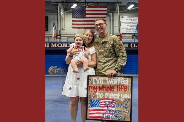 Sheyenne Schwenck, her husband and child.