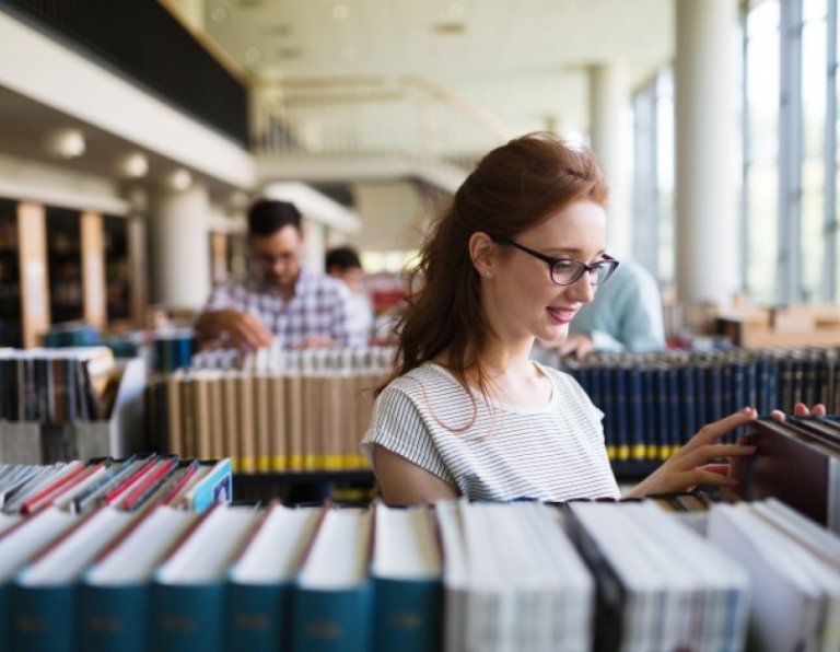 student woman library books